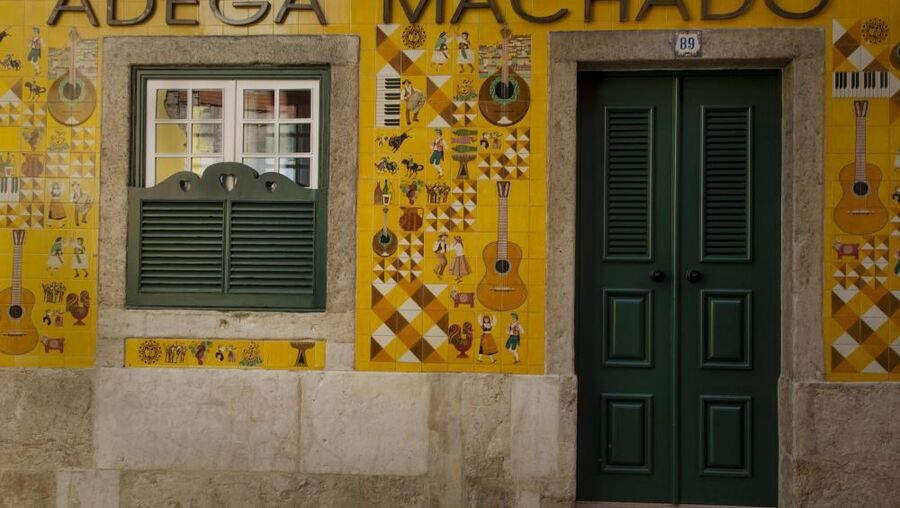 The beautiful façade of the Adega Machado is covered in painted tiles